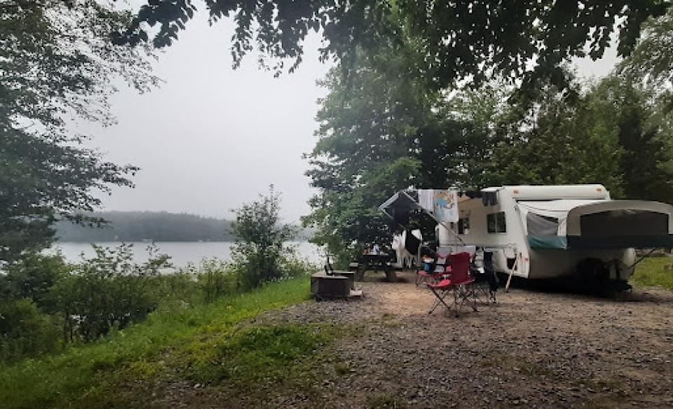 A sunset from a campground by the water