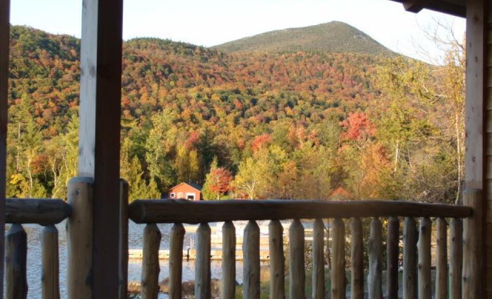 Scenic fall view with the mountainside covered with colorful trees.