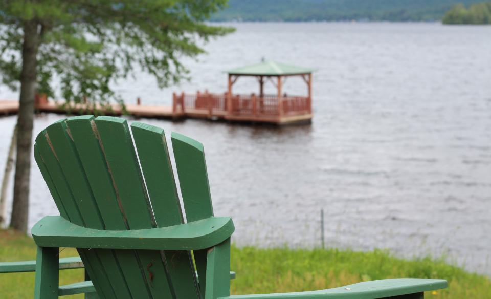 A gazebo floating on a dock in the water.