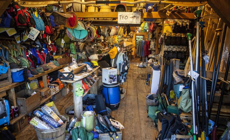 Shelves packed with colorful adventure gear.