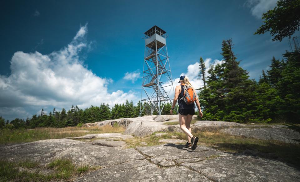 Hiker approaching a fire tower