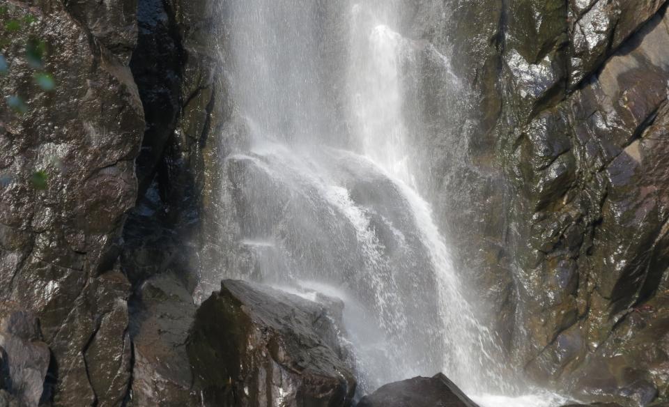Water splashing against boulders at the bottom of OK Slip Falls.
