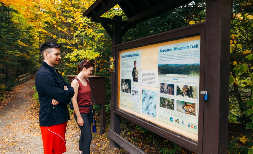A couple learning about Goodman Mountain's namesake