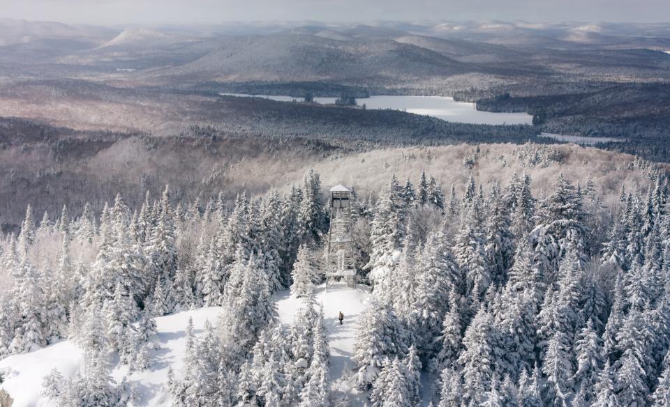 Aerial view of Owls Head Mountain firetower in the winter