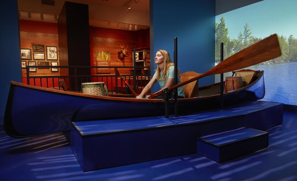 A woman rows a display boat
