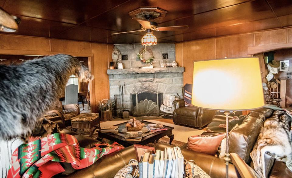 Fern filled front entrance with covered stairs