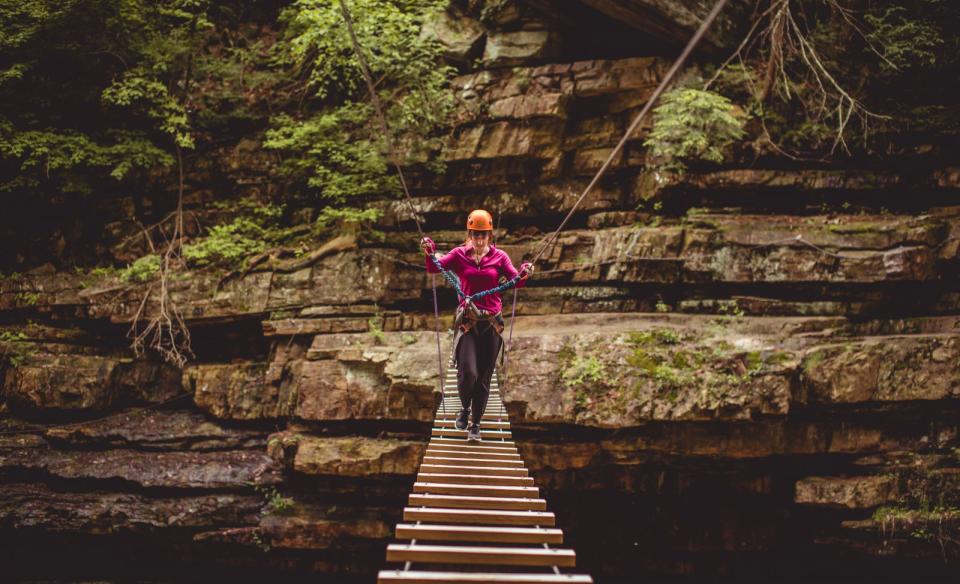 Take a daring walk across a wooden bridge to give unique perspective on the chasm