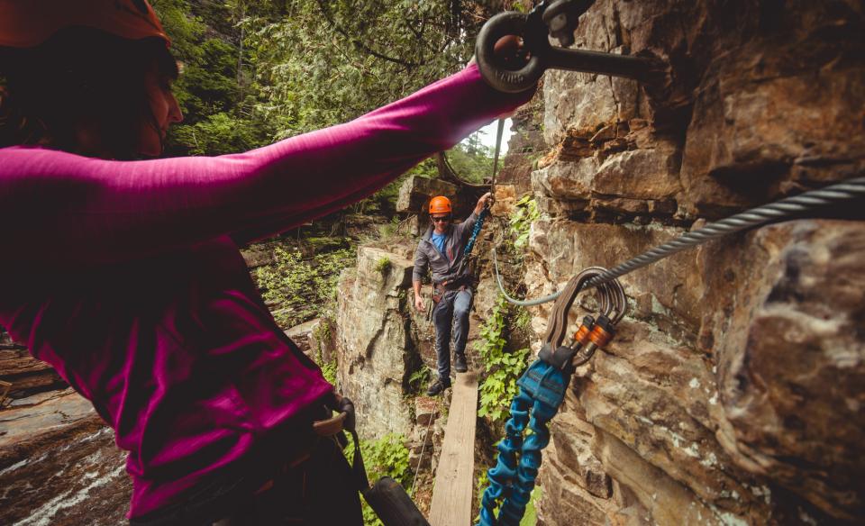 Experience the chasm from above harnessed to cables and walking wooden planks