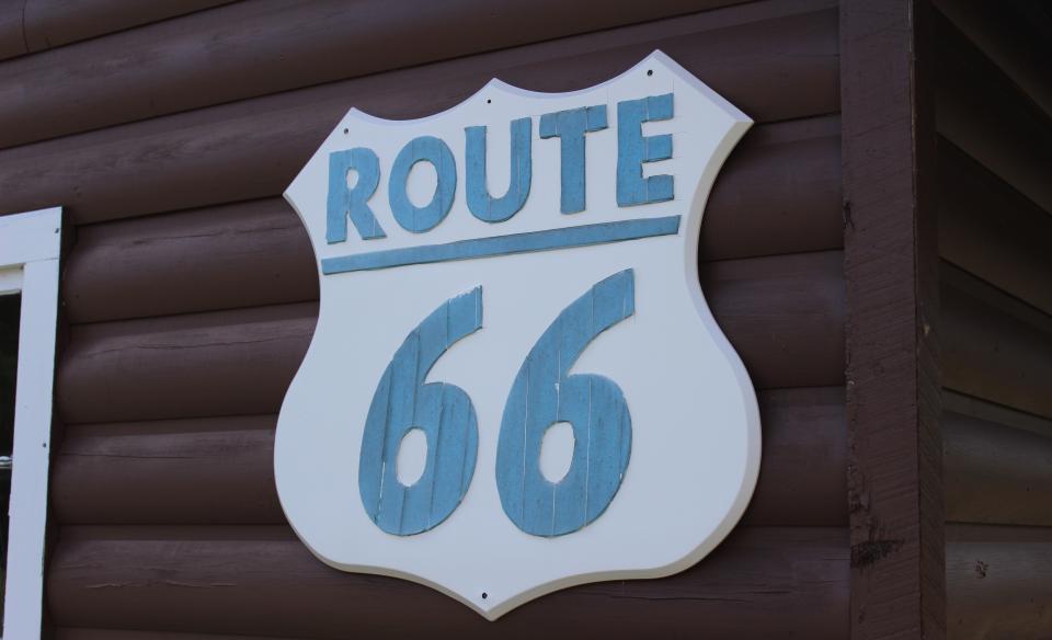 Close-up of a wooden road sign